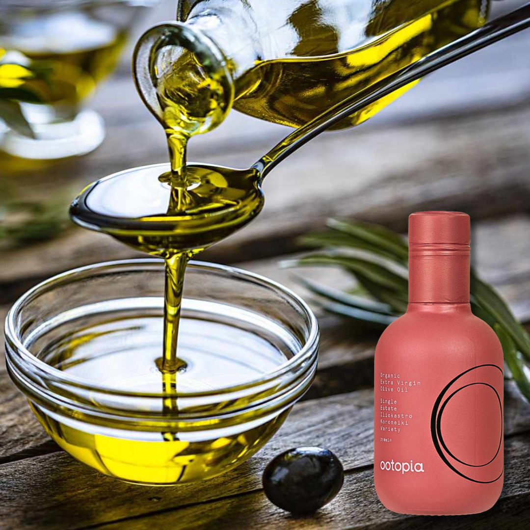 Pouring golden extra virgin olive oil with pink Ootopia Koroneiki bottle.